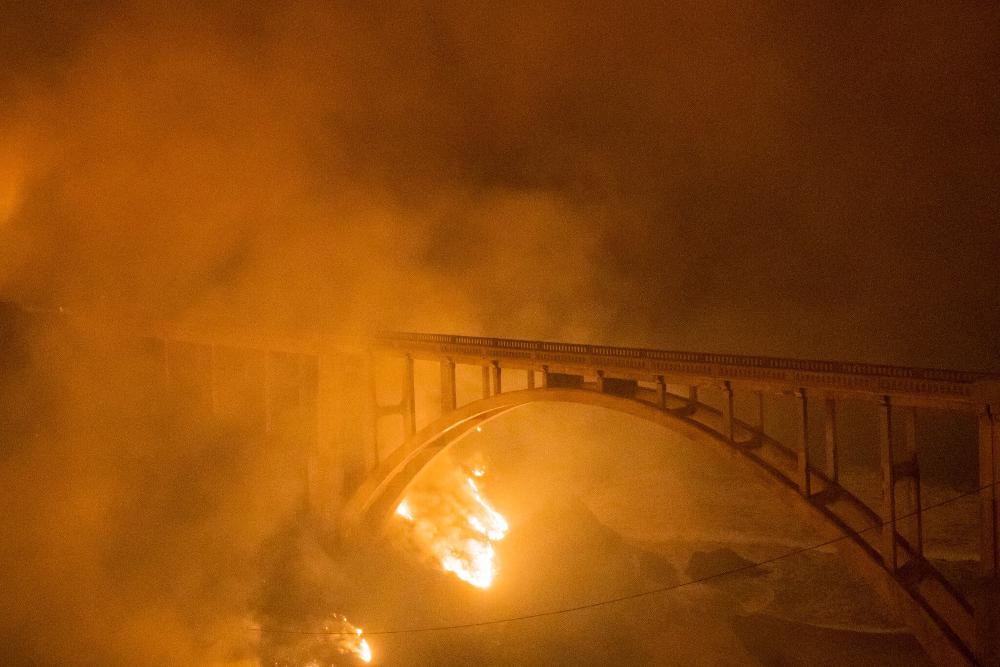 The Bixby bridge surrounded by fire